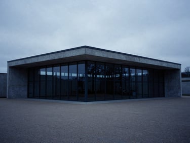 Wide angle architectural photograph of a modern concrete and glass pavilion in Luxembourg, cool overcast daylight, low-contrast shadows, deep blue and slate tones, minimalist composition, medium format film.