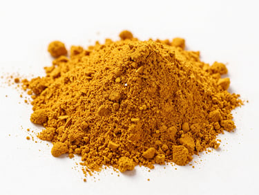 Macro studio shot of golden ginger powder and turmeric powder, bright high-key lighting, sharp focus.