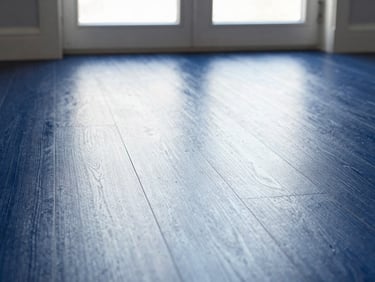 Close-up of a dust-free hardwood floor reflecting natural light from a window, clean lines, natural overcast daylight, crisp white and deep blue tones, sharp focus, 35mm