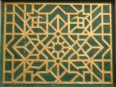 An elegant gold-leaf geometric pattern on a deep green background, traditional Islamic art detail, close-up.
