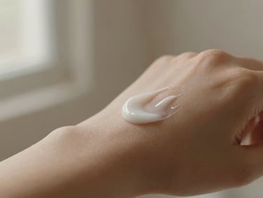 Minimalist product photography, close-up of smooth moisturizer being applied to skin, soft shadows, warm natural lighting, aesthetic composition, shallow depth of field, 35mm