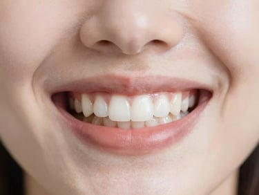 Soft focus dental aesthetics, clean clinical details, serene smile care, warm diffused daylight