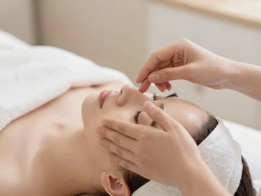 Close-up of gentle hands performing facial harmonization, soft warm lighting, elegant clinic setting