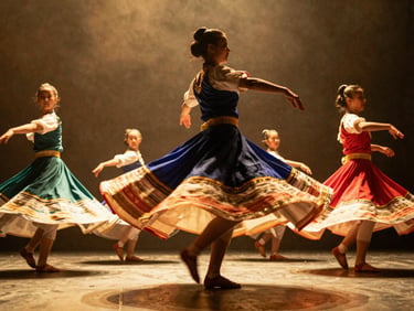 Dynamic low-angle shot of dancers in mid-motion, colorful traditional skirts spinning, dramatic stage lighting casting warm gold glows, 35mm film grain.