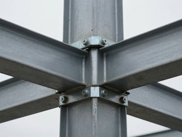 Close-up of a steel-to-concrete structural junction, bolts and flange plate visible, diffuse overcast light, no people, industrial grey tones, sharp focus on the assembly logic