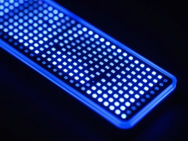 Macro detail of vibrant full-color LED display pixels, sharp focus, electric blue glow, dark studio background