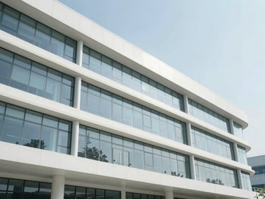 Architectural detail of a modern pharmaceutical research facility, clean glass and steel structure, bright natural daylight