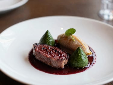 Close-up of a perfectly plated gourmet dish, soft natural light, shallow depth of field, rich textures, cozy restaurant setting.