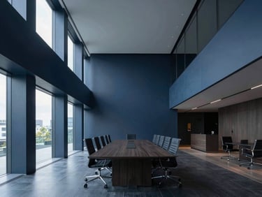 Wide symmetrical architectural angle of an empty high-end boardroom flooded with cool daylight, sharp structural geometry, deep navy and charcoal tones.