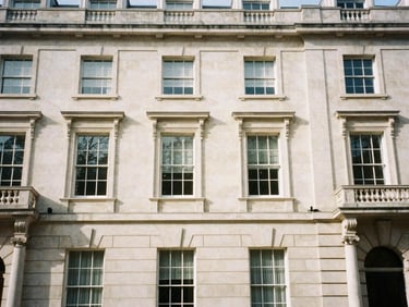 Architectural detail of a classic London limestone townhouse facade, soft natural afternoon light, medium format film style.