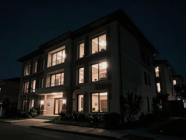 Cinematic shot of a luxury real estate property, dramatic lighting, wide angle, 16:9 aspect ratio, deep shadows, anamorphic lens flares