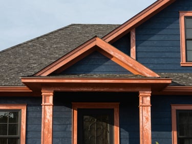 Crisp architectural detail of a classic Midwestern home exterior, warm copper accents, bright daylight