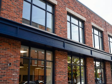 Modern brick commercial building interior in Rockford, natural light streaming through large windows