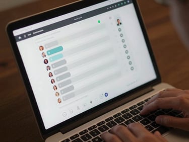Close-up overhead shot of a laptop screen showing a Zoom poll interface with visible response bars and participant counts, a hand resting near the trackpad, even studio lighting, saturated but not artificial, no harsh shadows, screen content sharp and legible