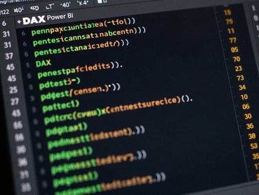 Close-up detail of clean DAX code formulas on a dark screen, with the crisp edge of a Power BI canvas showing green and amber bar charts, high-contrast technical aesthetic.