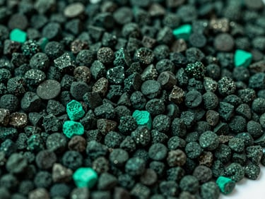 Abstract dark carbon biochar grains close-up, sharp focus, structured lighting, deep forest green tones, 35mm
