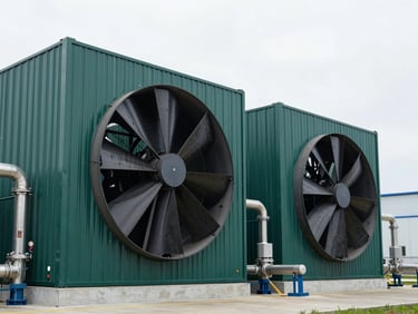 High-tech carbon capture facility with massive fans and industrial steel pipes, clean architectural lines, overcast daylight, sharp focus, 35mm