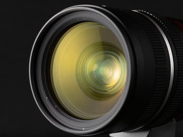 Extreme close-up of a high-end anamorphic camera lens, sharp reflections of neon yellow light, dark studio background.
