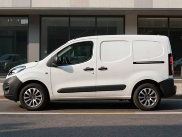 Side view of a modern white Fiat Fiorino parked on a clean city street, bright morning light, professional cargo transport aesthetic.