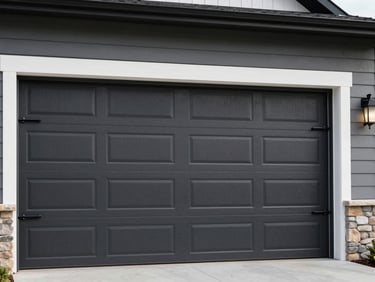 Residential garage door partially off its track, showing the wheel dislodged from the rail. Clean, high-contrast lighting, modern American home.