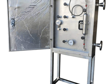 Industrial stainless steel gas sampling system cabinet with pressure gauges and foil insulation.