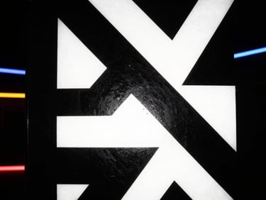 Album cover art featuring high-contrast black and white abstract geometric shapes, direct flash, gritty texture.