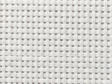 Macro photograph of high-density white cotton thread weave, showing the precise grid of the textile under bright neutral daylight
