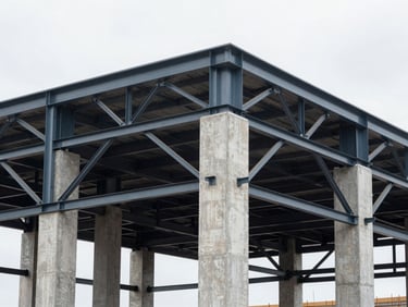 Technical detail of a modern structural retrofit showing reinforced concrete pillars and steel brace frames on-site