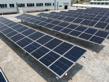 Wide shot of a large-scale solar panel manufacturing facility floor, clean industrial lighting, high contrast, deep slate and steel tones, 35mm