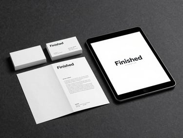 Finished brand system displayed in context — a cohesive set of business cards, a folded brochure, and a digital mockup on a tablet, arranged on a dark charcoal surface under focused studio light, every element aligned and resolved