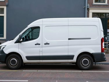 A clean white service van parked on a quiet street along a canal in Amsterdam, soft natural daylight, professional and reliable look.