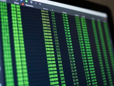 Macro close-up of a high-resolution trading terminal screen displaying clean green code matrices and real-time order logs, low-key cool ambient light