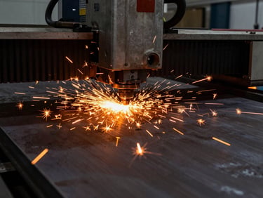 High-power Fiber Laser machine cutting a thick steel plate, bright orange sparks flying everywhere, high-contrast industrial workshop lighting, 35mm