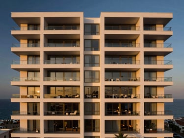 Architectural shot of a modern luxury apartment building facade in Malabata Hills, white clean geometric lines, large glass terraces facing the sea, twilight lighting.