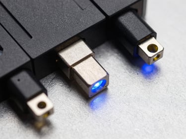 Macro shot of hardware connections on a clean metallic surface with glowing blue LED accents, high-contrast