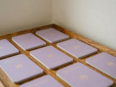 A serene corner of a room with prayer cards resting on a wooden tray under diffused natural daylight, 35mm