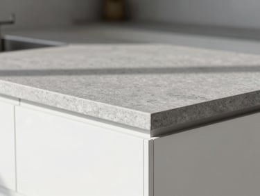Close-up of a premium minimalist kitchen under bright natural light, clean joints, flawless grey stone countertop, architectural photography