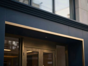 Elegant architectural details of a modern law office, soft window daylight, deep navy and muted gold tones, shallow depth of field, 35mm, a clean, abstract representation of order.