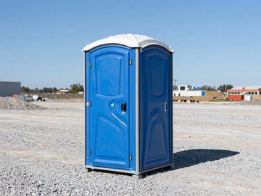 A spotless blue standard portable toilet unit placed neatly on a clean, organized gravel construction site, bright daylight, sharp focus