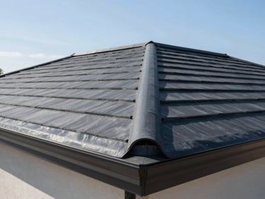 Close-up of a perfectly sealed dark grey EPDM rubber roof installation on a modern extension, clean lines, bright daylight