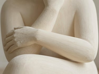 Abstract hand-carved wooden sculpture, smooth and flowing forms, representing emotional resilience and calm, soft natural daylight, warm ivory tones, shallow depth of field