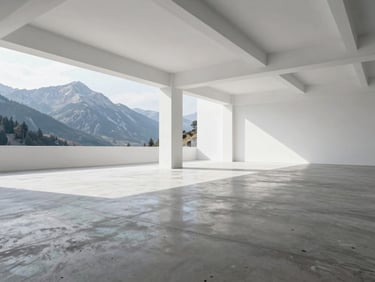 Crisp architectural interior of a bright, empty warehouse bay with polished concrete floors and high ceilings, natural daylight.
