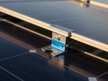 Macro technical detail of a structural-grade steel mounting bracket on a solar panel array, golden-hour reflections on glass, deep obsidian shadows, 35mm.