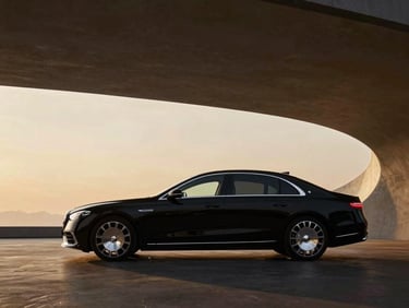 Elegant side profile of a luxury sedan, sleek black paint, parked on a polished dark surface, soft studio lighting, wide-angle lens.
