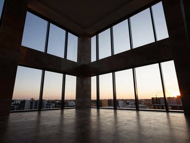High-contrast wide-angle shot of a luxury apartment interior with floor-to-ceiling windows, dramatic natural light, editorial style.