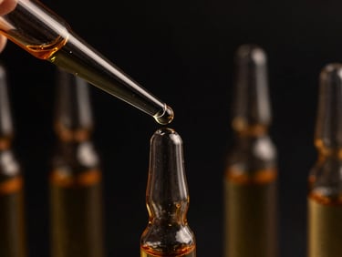 Preparation of homeopathic dilutions in dark glass vials, macro shot of droplets, warm gold highlights, deep black background