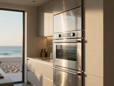 Close-up of a modern, sleek kitchen interior with high-end stainless steel appliances and natural light. Architectural framing.