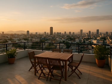 Rooftop terrace view from a high-floor apartment in Cẩm Lệ district Đà Nẵng, Đà Nẵng city skyline visible in the background, golden hour light, wide environmental framing