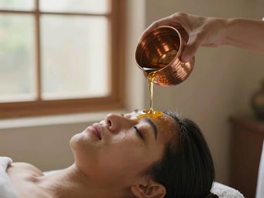 Warm herbal oil poured gently onto forehead during Shirodhara therapy, authentic copper vessel, soft window light, warm editorial photography.