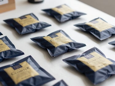 Close-up of premium packaged goods on a clean workspace table in Tampa, soft natural light, professional editorial style.